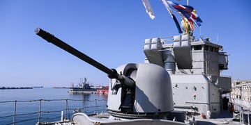 greece war ship, grey metal, flags, blue sky