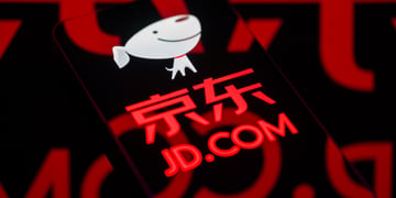 black smartphone screen, jd.com logo, chinese letters, white smiling dog with big head
