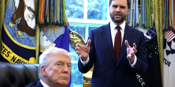 JD Vance gesticulating as Donald Trump looks on