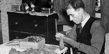 man darning socks 1937 getty images