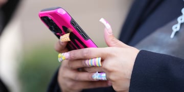 phone user with long nails