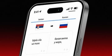 Screen with Google Translate window, phrase "white villa by the sea" in Russian and Serbo-Croatian