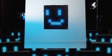 A face made from blue tetri-like blocks that looks like on a computer screen