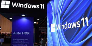 windows 11 logo on top left corner in black and white, and on right in blue and white