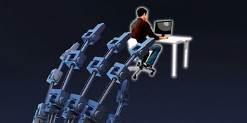A huge robot's hand reaching to an employee working at their laptop
