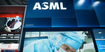 asml white letters shining above booth, doctor in light blue scrubs, face mask, 