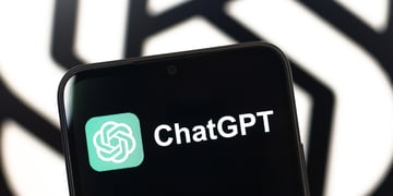The ChatGPT logo is seen displayed on a smartphone screen.