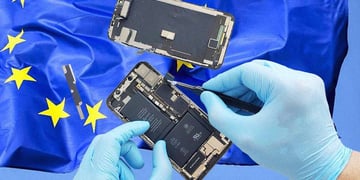 Two hands wearing gloves are repairing a phone, the EU flag on the background