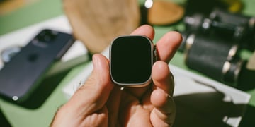 Man's hand holding Apple Watch Ultra body
