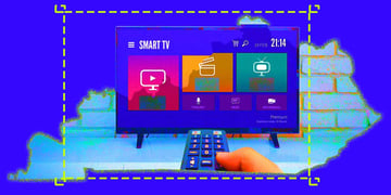 A hand holding a remote control directed to a smart TV, map of Kentucky behind it