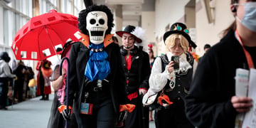 cosplayer, Brook from One Piece costume, white broken scull, red umbrella, shiny blue blouse