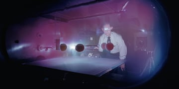 A retro photo of a plasma scientist.