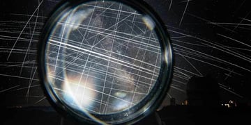 People watching lights in the dark sky