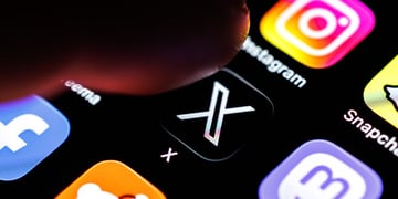 The logo of the X app (formerly Twitter) can be seen on the display of a smartphone in Munich