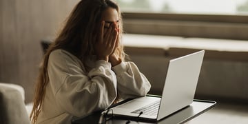 young woman using infected computer
