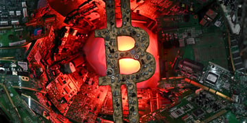 bitcoin logo made from spare metal parts or scrap metal, red light, green micro chips