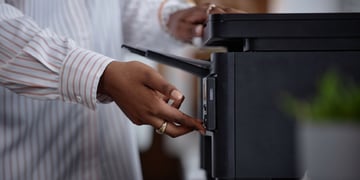 Woman using a black printer