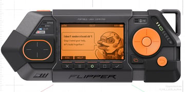 black plastic device with orange screen, dolphin image