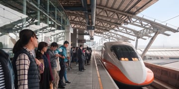 People waiting in a station for high-speed train