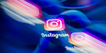 three instagram logos, two blurry, meta logos, the blue infinity signs, in the background