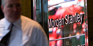 morgan stanley sign in red glass, fat man in white shirt, black tie, bald head 