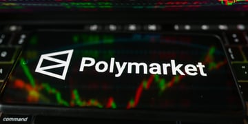 polymarket logo, white letters on black smartphone screen, market percentage charts in the back