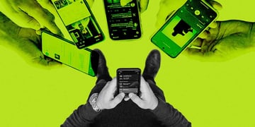 Person standing with a smartphone in hand