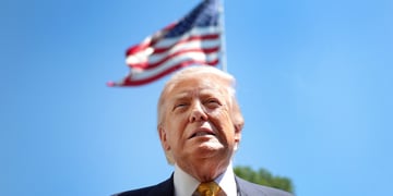 US President Donald Trump, blonde hair, usa flag in wind, blue clear sky, white collar shirt