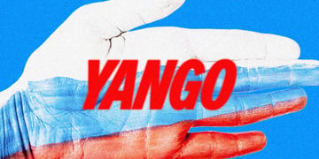 A hand covered in Russian flag colors holding Yango logo