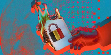 A burning paper that has a lock with a belgium flag