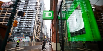 Toronto Dominion Bank logo, green background, white D, tall glass buildings, green reflection