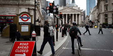 Bank of England building ,cyclist, red traffic sign, 