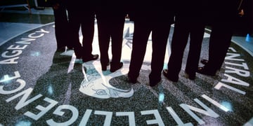 Footsteps and shadows on the CIA logo.
