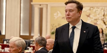 elon musk, black tux, dark blue tie, white collar shirt, fancy environment