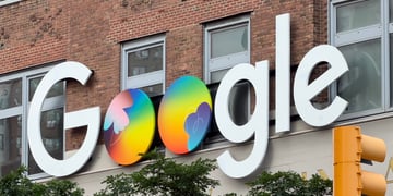 google logo, two colorful globes instead of two o's, yellow traffic light, brick building
