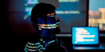 man with beard and moustache, profile, glowing code all over his face and shoulder line