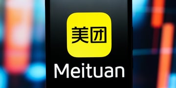 meituan logo, white letter, yellow square with round shapes, black smartphone screen