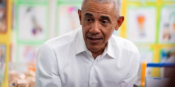 Barack Obama smiling in a school.