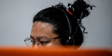 philippinese woman, black hear, messy bun, black headset ,dark skin, glasses, oily skin forehead