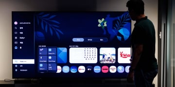 Samsung smart TV with a person in the background