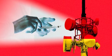 Hands holding a smartphone, German flag, a cell site