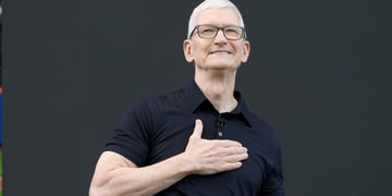 Apple CEO Tim Cook, right hand on heart, white male, grey white hair, left hand on heart