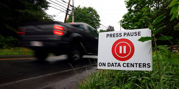 Signs against data centers line Lockhouse Road,