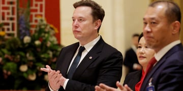 elon musk, white male, black suit, white collar shirt, asian man and woman, red shirt
