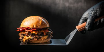 burger on metal spatula,