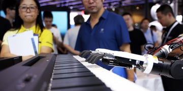 black humanoid hand fingers play piano, asian man in blue shirt, asian woman, black hair, yellow top