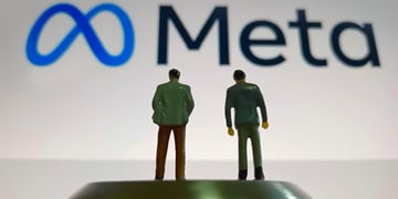 meta written in black, blue eternity symbol logo, two human figurines in suits