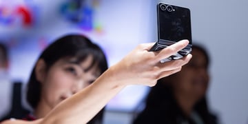 A person looks at a Samsung Galaxy Z Flip 8 smartphone