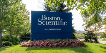 corporate sign with name on grass