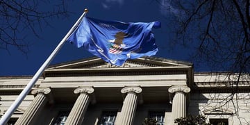 US department of justice building and flag